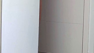 Sunbathing on the balcony topless