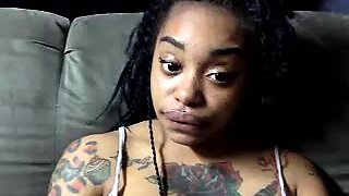 Tattooed ebony babe flaunts her hot curves and sweet holes