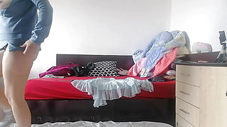 Amateur wife has fun trying on clothes that she cuts herself. Amateur wife dances naked around the house.
