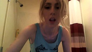 Attractive blonde camgirl fucks a dildo in the shower