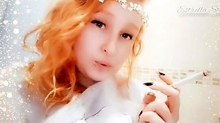Redhead teen smokes a cigarette and shows off her big tits