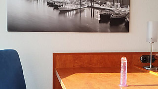 Tranny fucks herself on the desk