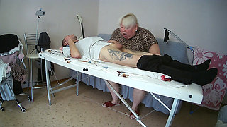 Mother-in-law sucks and jerks off my dick on the massage table and swallows cum