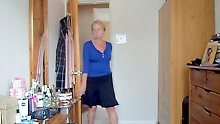 Wearing a blue skirt and flashing her tits