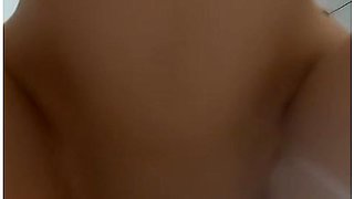 Close-up strap-on action on a perfect pussy