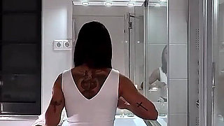 Miniskirt Lover Raver Girl Reveals Her Piercing on Her Pussy in the Bathroom by Lifting Her Short Skirt