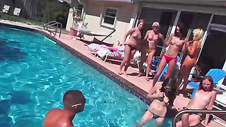 Pretty little gals sucking cocks during some wild pool party