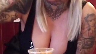 Blonde tattooed milf eats spaghetti on the toilet