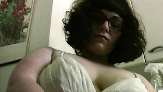 MILF Bianca Dagger with natural tits caresses herself in the kitchen