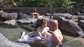Jun Suehiro gives a handjob in a bath to a bald man