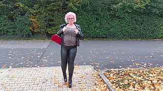 Naughty Granny Tongue Out Flashing Big Tits in Public