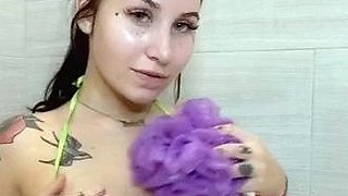 Busty babe playing with her big boobs