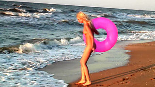 Hot naked blonde on the beach