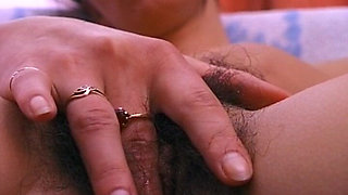 German Babe Plays with Her Hairy Pussy in Close up
