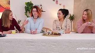 Four adorable teens play with each other's pussies on camera