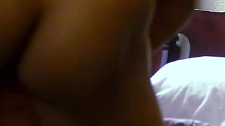 Big ass brunette rides her lover's big black dick