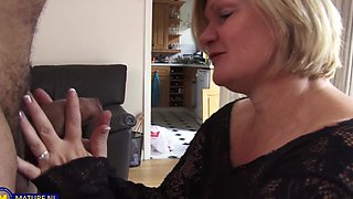 Granny Nathan gives a good handjob and shows her shaved pussy.
