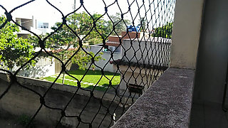 Naked wife touching herself on the balcony