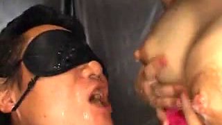 Submissive Japanese man tastes milk from boobs