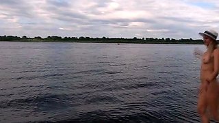Exhibitionist Blonde Goes Nude on a River Beach
