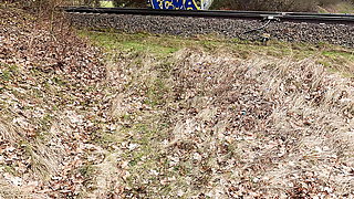 Slapping her naked tits and ass near railway